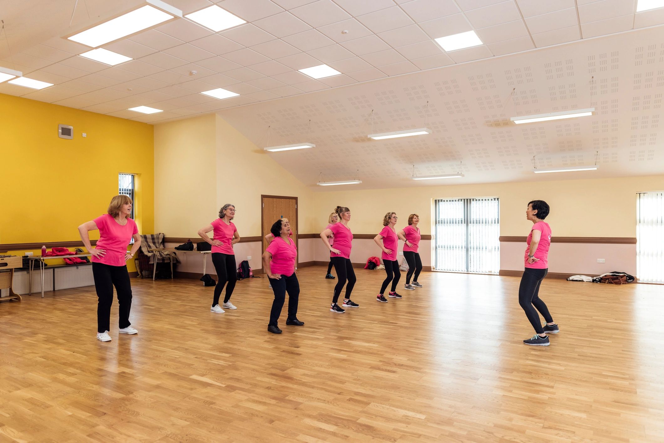 Group learning synchronized dance steps in a class